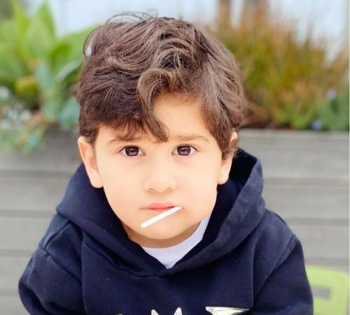 Ciro Messi posing for a photoshoot. 